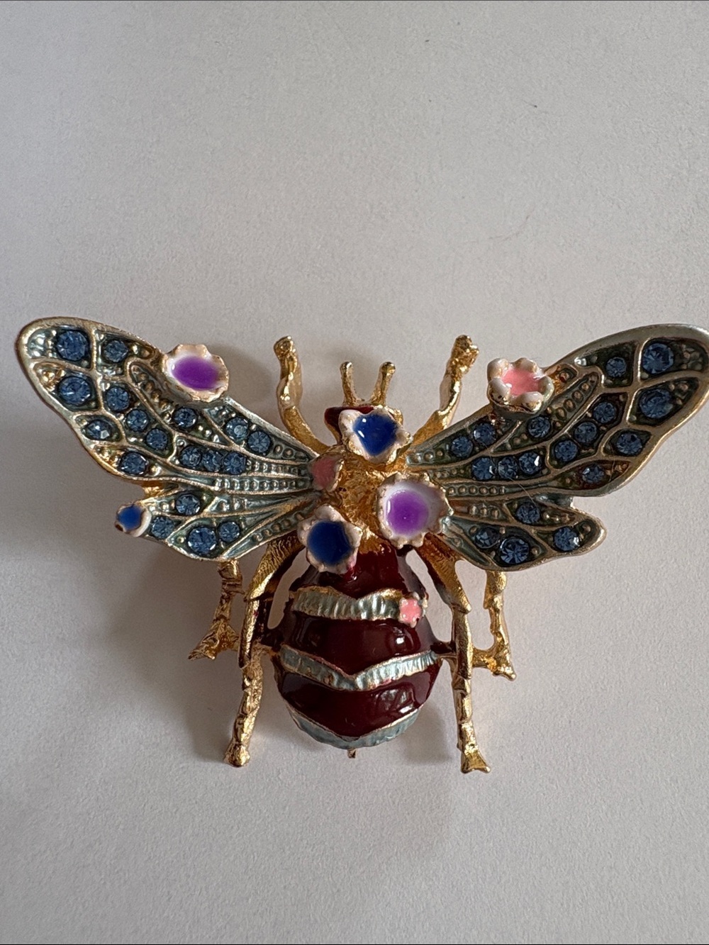 Gold-Tone Bee Brooch with Blue Rhinestones and Purple Enamel Flowers